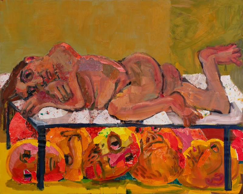 A woman laying on a table and under there are many heads 